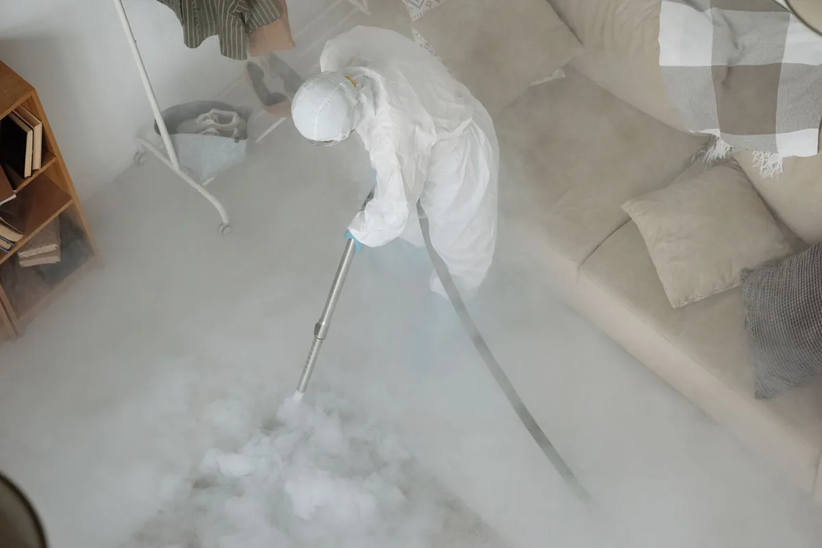 Biohazard cleanup technician in protective equipment, Waverly, OH